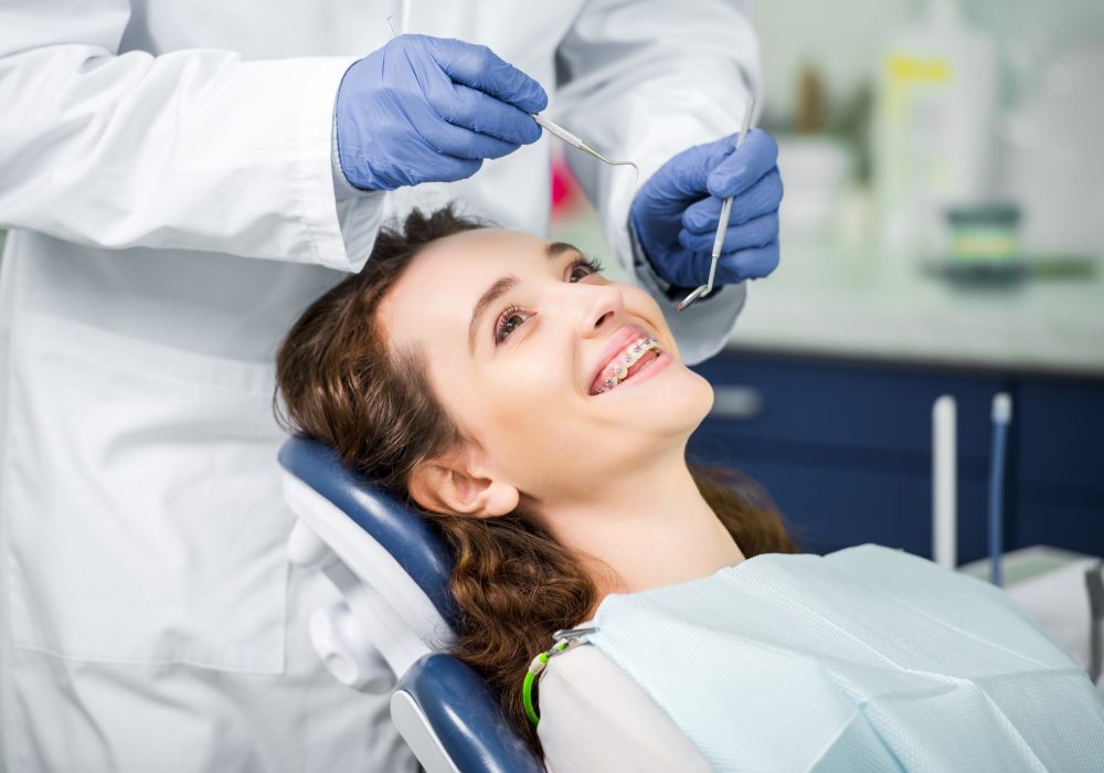cropped-view-of-dentist-in-latex-gloves-examining-cheerful-woman-in-braces.jpg Cosmetic Dentistry in Wantirna